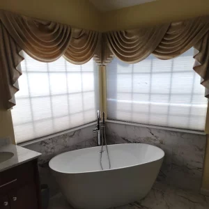 bathroom remodel with bathtub in corner