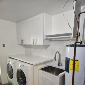 Laundry room with checkered tiles