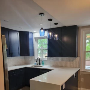 Blue Cabinets in kitchen remodel over sink area